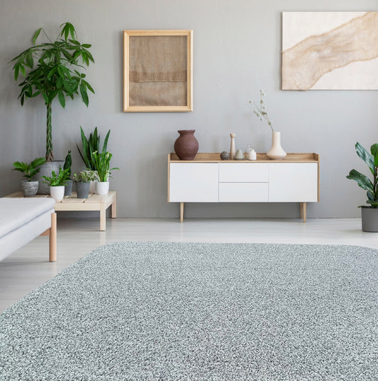 Mingled Grey Frieze Area Rug in living room