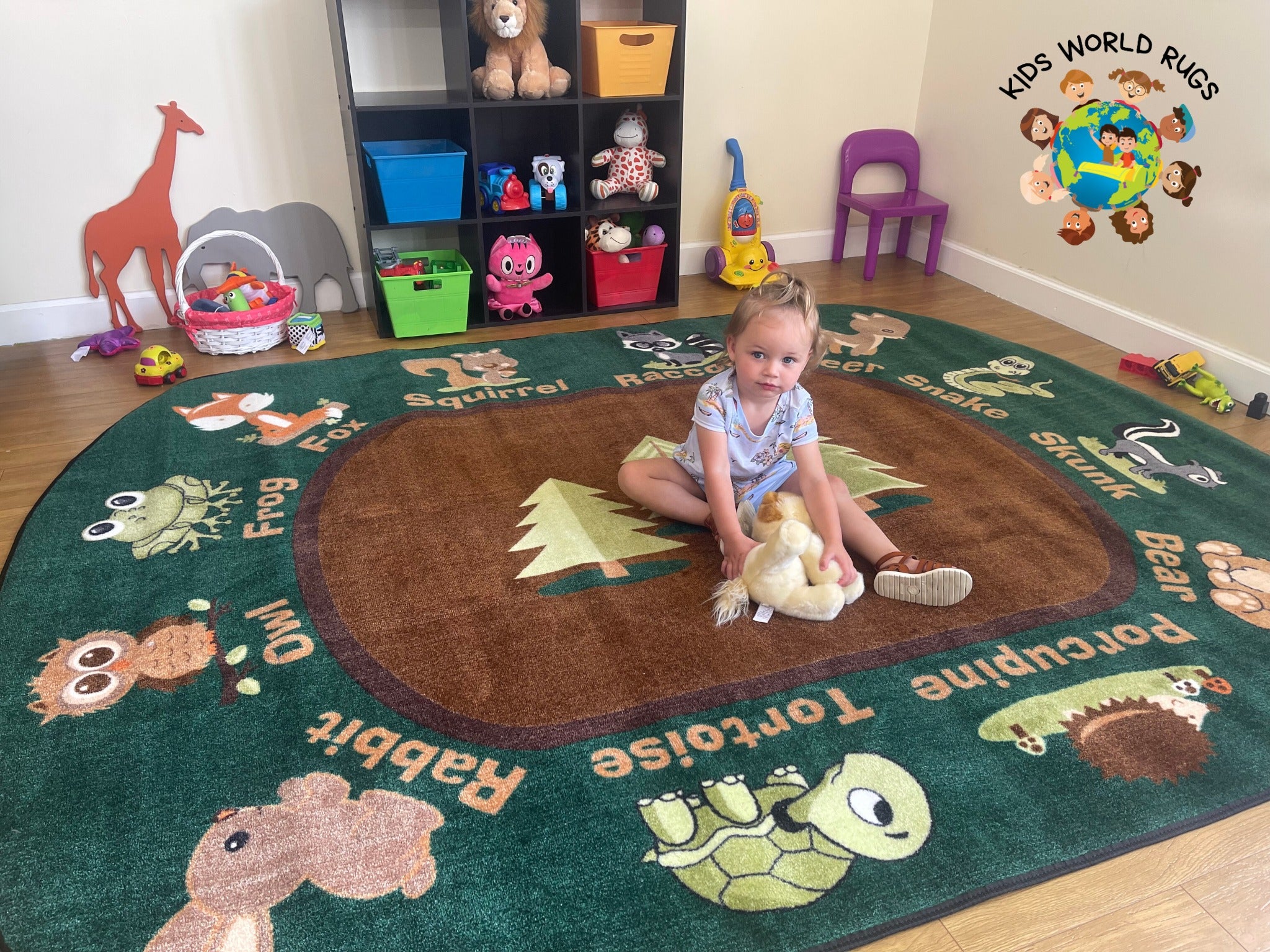 child playing on animals rug