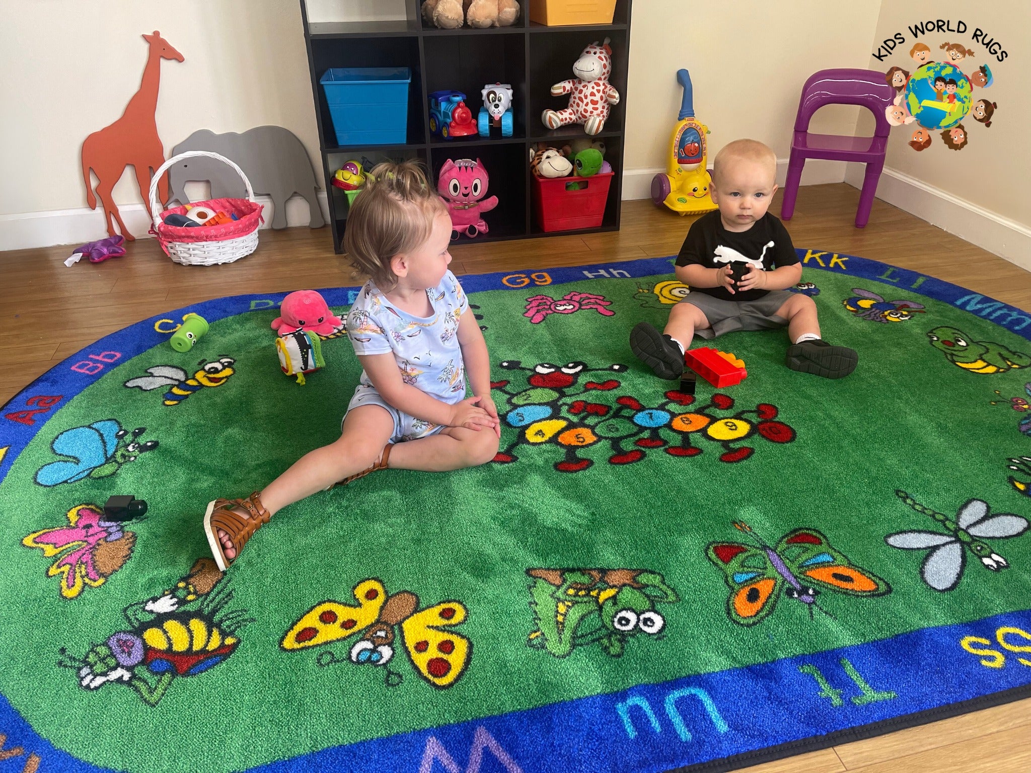 kids on classroom alphabet critter rug