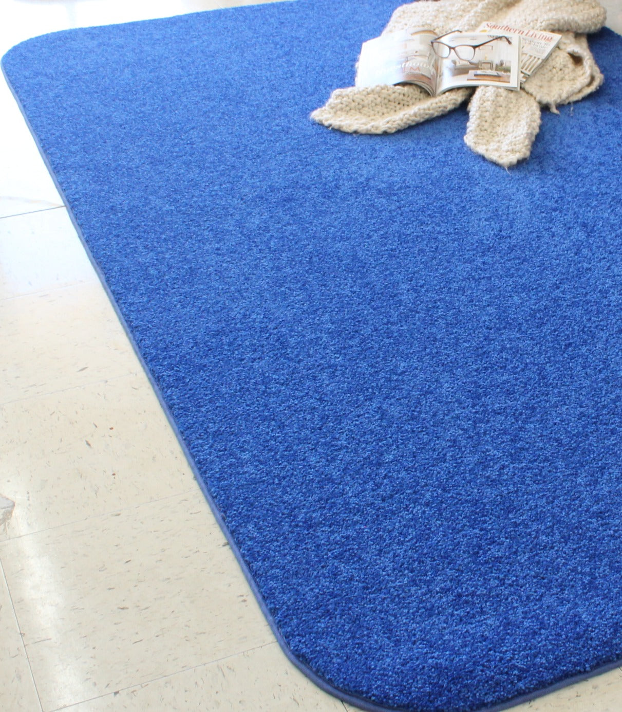 Royal Blue Area Rug under book and glasses