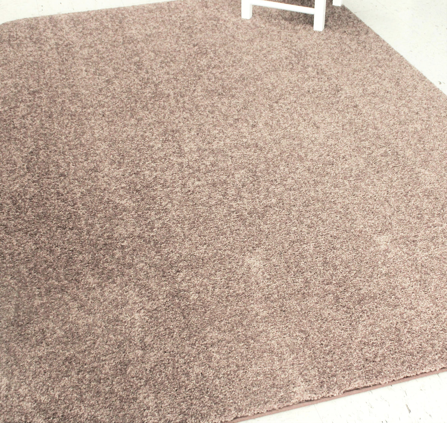 Winter Brown Area Rug on tile floor with chair