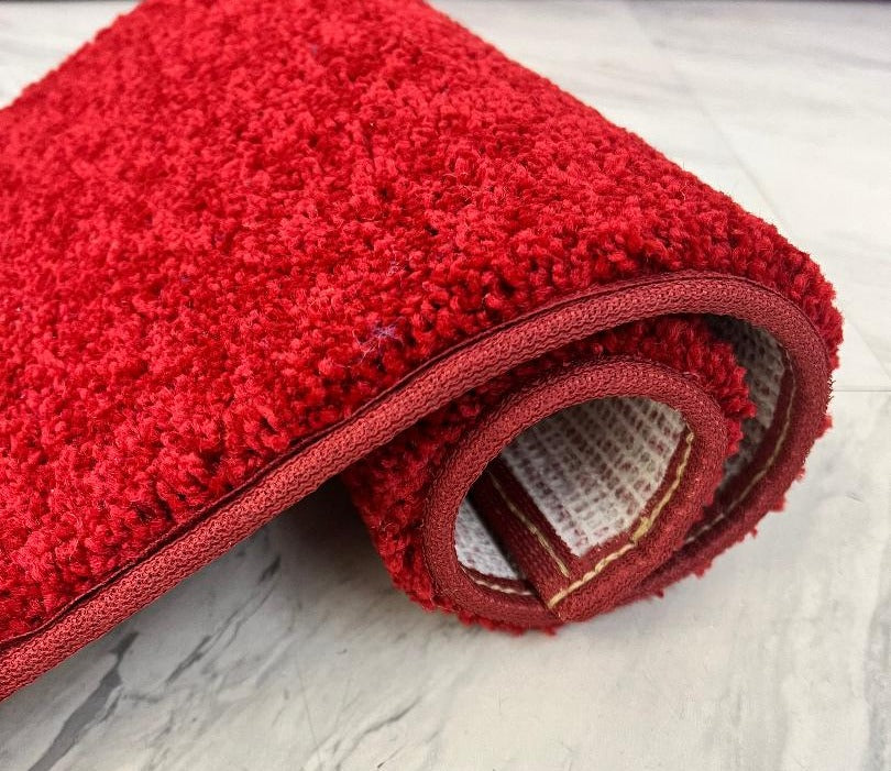 Apple Red Area Rug rolled up